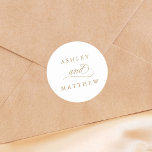 Gold Romantic Swirly Calligraphy Wedding Classic Round Sticker<br><div class="desc">This gold and white wedding sticker featuring elegant and romantic swirly calligraphy lettering with your names. For more advanced customisation of this design,  please click the BLUE DESIGN TOOL BUTTON above!</div>