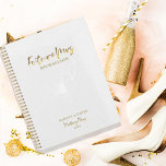 Gold Script Future Mrs. Wedding Planner<br><div class="desc">Romantic design features a soft floral flower in white,  "Future Mrs.",  and the words "Wedding Plans" in a gold typography script against a white textured background.  Easily customise your names and date of choice.  The perfect gift idea for the bride-to-be to organise all her wedding planning needs.</div>