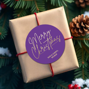 Gold Script Merry Christmas on Purple Classic Round Sticker