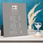 Gold Sewing Machine Seamstress Gray pricing   Plaque<br><div class="desc">Understated design displays your services, price list or business information beneath an illustration of a vintage sewing machin in faux gold over a Gray taupe background and your name or business name. Includes three customizable headings and body text fields. To adjust layout, enter your text and then use the Customize...</div>