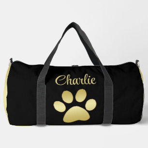 Gold Shiny Dog Paw on black background Duffle Bag