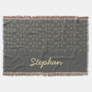 Gold snowflakes on grey throw blanket