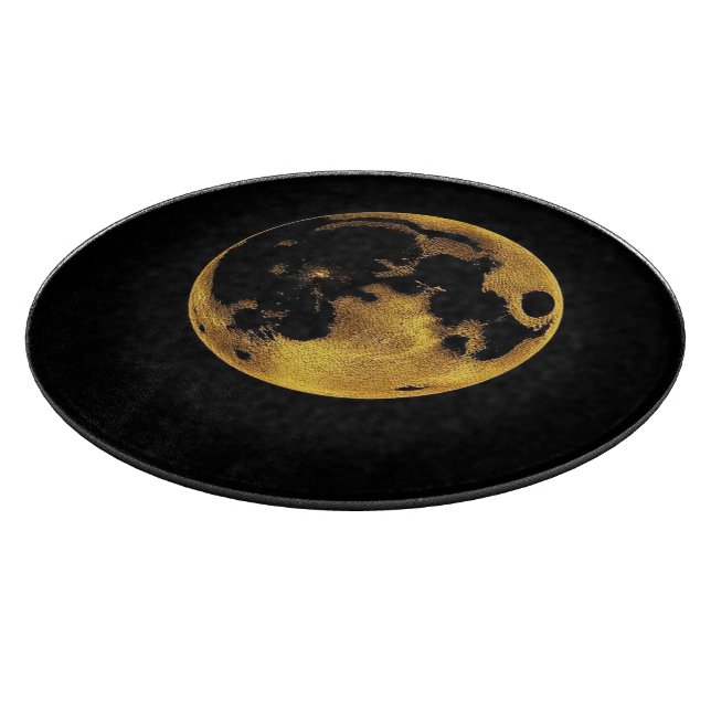 Gold textured moon on dark black cutting board (Corner)