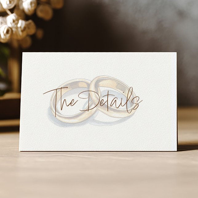 Gold wedding rings background the details enclosure card (Gold rings details card with elegant script on cream background)