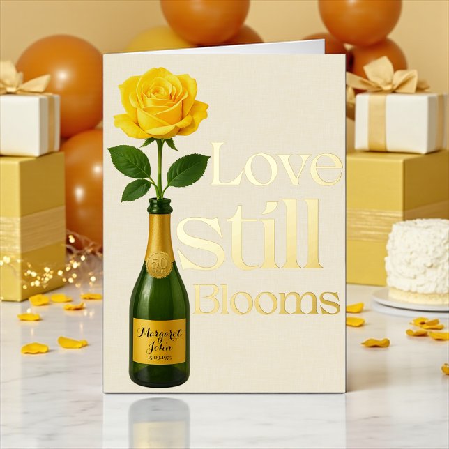 Golden 50th Wedding Anniversary Love Still blooms Foil Holiday Card (Golden 50th anniversary card with yellow rose and champagne bottle design)