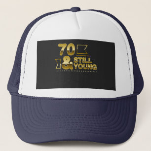 Golden 70 and still young 70th birthday quote trucker hat
