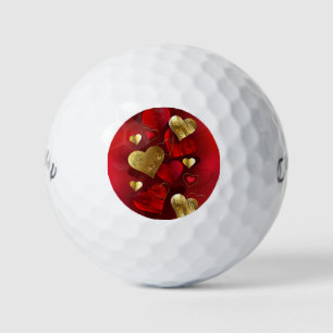 Golden and red valentines golf balls
