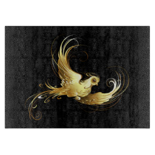 Golden Bird on Black Background Cutting Board