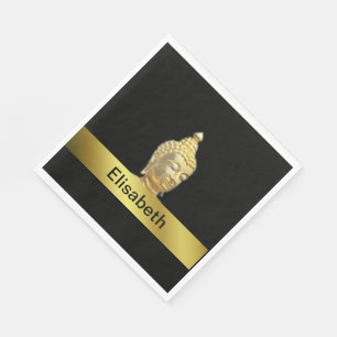 golden buddha in black paper napkins