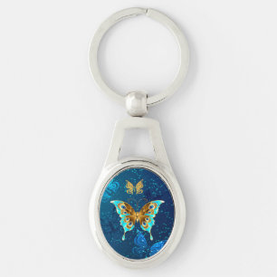 Golden Butterflies on a Blue Background Key Ring