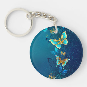 Golden Butterflies on a Blue Background Key Ring
