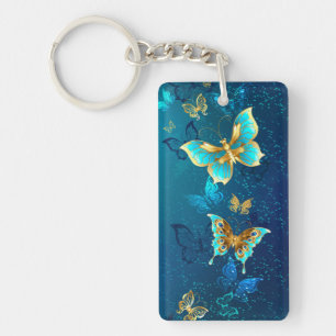 Golden Butterflies on a Blue Background Key Ring