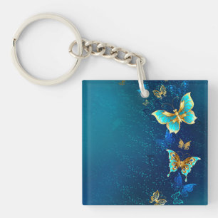 Golden Butterflies on a Blue Background Key Ring