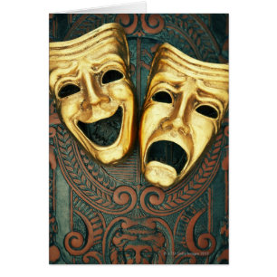 Golden comedy and tragedy masks on patterned