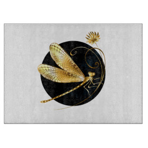 Golden dragonfly in black circle cutting board