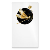 Golden dragonfly in black circle