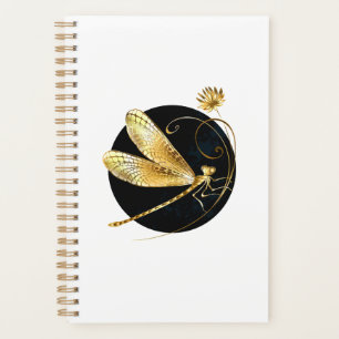Golden dragonfly in black circle planner