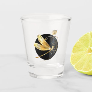 Golden dragonfly in black circle shot glass