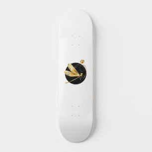 Golden dragonfly in black circle skateboard