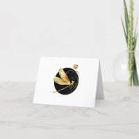 Golden dragonfly in black circle