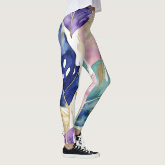 Golden-edged tropical leaves in vibrant harmony leggings