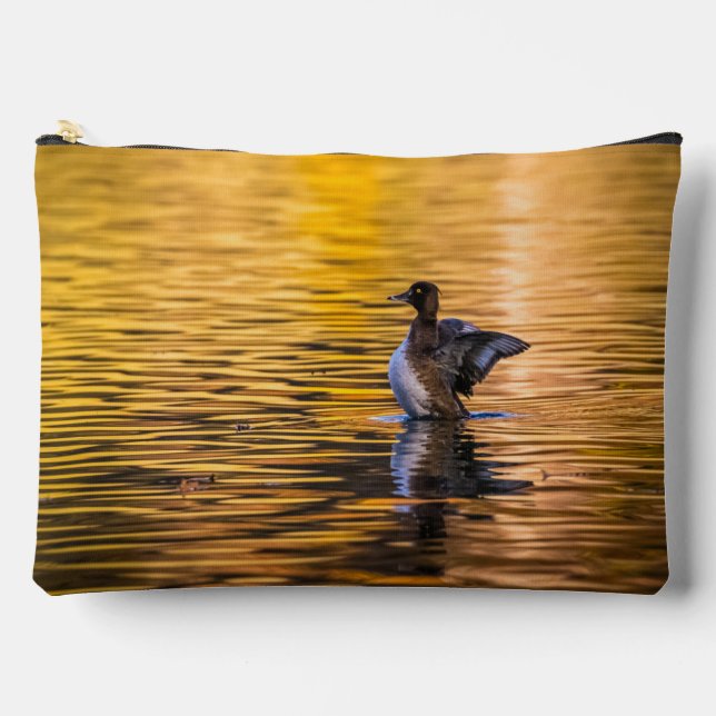 Golden eye on a golden lake accessory pouch (Front)