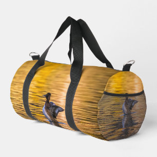 Golden eye on a golden lake duffle bag