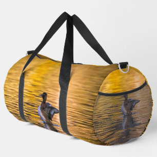 Golden eye on a golden lake duffle bag