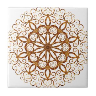 Golden filigree flake on white tile