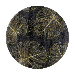 Golden monstera leaves, romantic seamless floral. cutting board