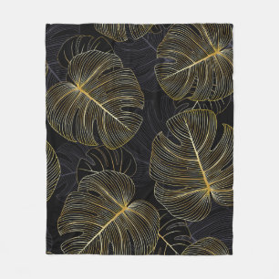 Golden monstera leaves, romantic seamless floral. fleece blanket