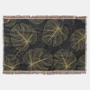 Golden monstera leaves, romantic seamless floral. throw blanket