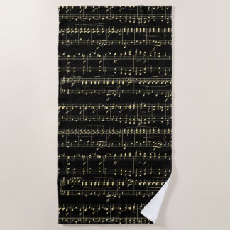 Golden Music on Black Beach Towel