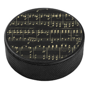 Golden Music on Black Hockey Puck