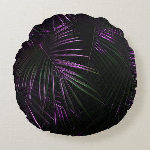 Golden painted date palm leaf closeup on dark blac round cushion