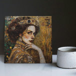 Golden Phase Gustav Klimt Mosaic Edwardian Woman C Tile<br><div class="desc">This beautiful ceramic tile features an artwork inspired by Gustav Klimt's "golden phase, " depicting a woman from the Edwardian era. During this period, Klimt was fascinated with Byzantine mosaics and developed his mosaic technique using gold leaf and vibrant colours. This artwork pays tribute to Klimt's innovative mosaic approach and...</div>