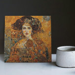 Golden Phase Gustav Klimt Mosaic Edwardian Woman C Tile<br><div class="desc">This beautiful ceramic tile features an artwork inspired by Gustav Klimt's "golden phase, " depicting a woman from the Edwardian era. During this period, Klimt was fascinated with Byzantine mosaics and developed his mosaic technique using gold leaf and vibrant colours. This artwork pays tribute to Klimt's innovative mosaic approach and...</div>