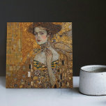 Golden Phase Gustav Klimt Mosaic Edwardian Woman C Tile<br><div class="desc">This beautiful ceramic tile features an artwork inspired by Gustav Klimt's "golden phase, " depicting a woman from the Edwardian era. During this period, Klimt was fascinated with Byzantine mosaics and developed his mosaic technique using gold leaf and vibrant colours. This artwork pays tribute to Klimt's innovative mosaic approach and...</div>