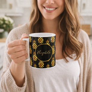 Golden pineapple on black gold name coffee mug