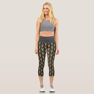 Golden polygonal lobster crawfish on black capri leggings