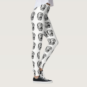 Golden retriever puppy portrait in black and white leggings