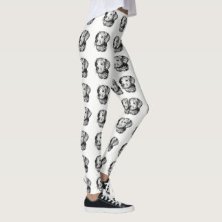 Golden retriever puppy portrait in black and white leggings