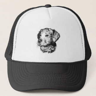 Golden retriever puppy portrait in black and white trucker hat