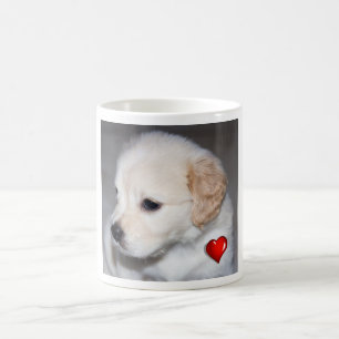 Golden retriever puppy with a red heart mug