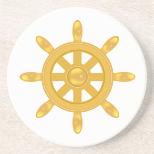 Golden ship wheel on white coaster