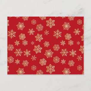 Golden snowflakes against deep red postcard