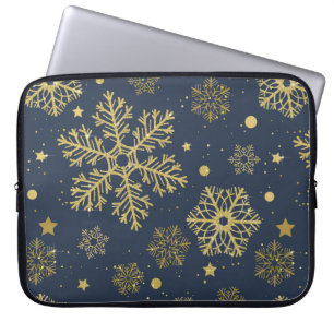 Golden snowflakes on navy laptop sleeve