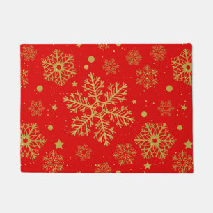 Golden snowflakes on red doormat