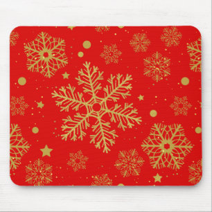 Golden snowflakes on red mouse pad
