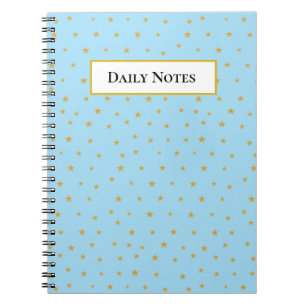 Golden stars on light turquoise blue notebook